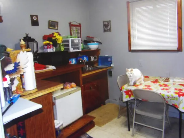 a room with a window and shelf