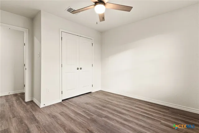 a view of a house with wooden floor and a sink