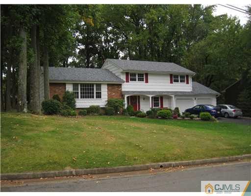22 Huntington Road Edison, NJ 08820 - Photo 1 of 9 a front view of a house with a garden