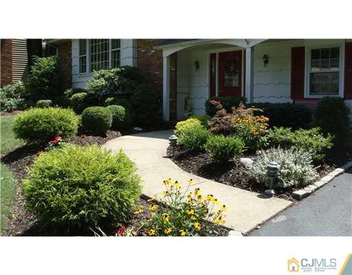 22 Huntington Road Edison, NJ 08820 - Photo 4 of 9 a view of a house with a backyard