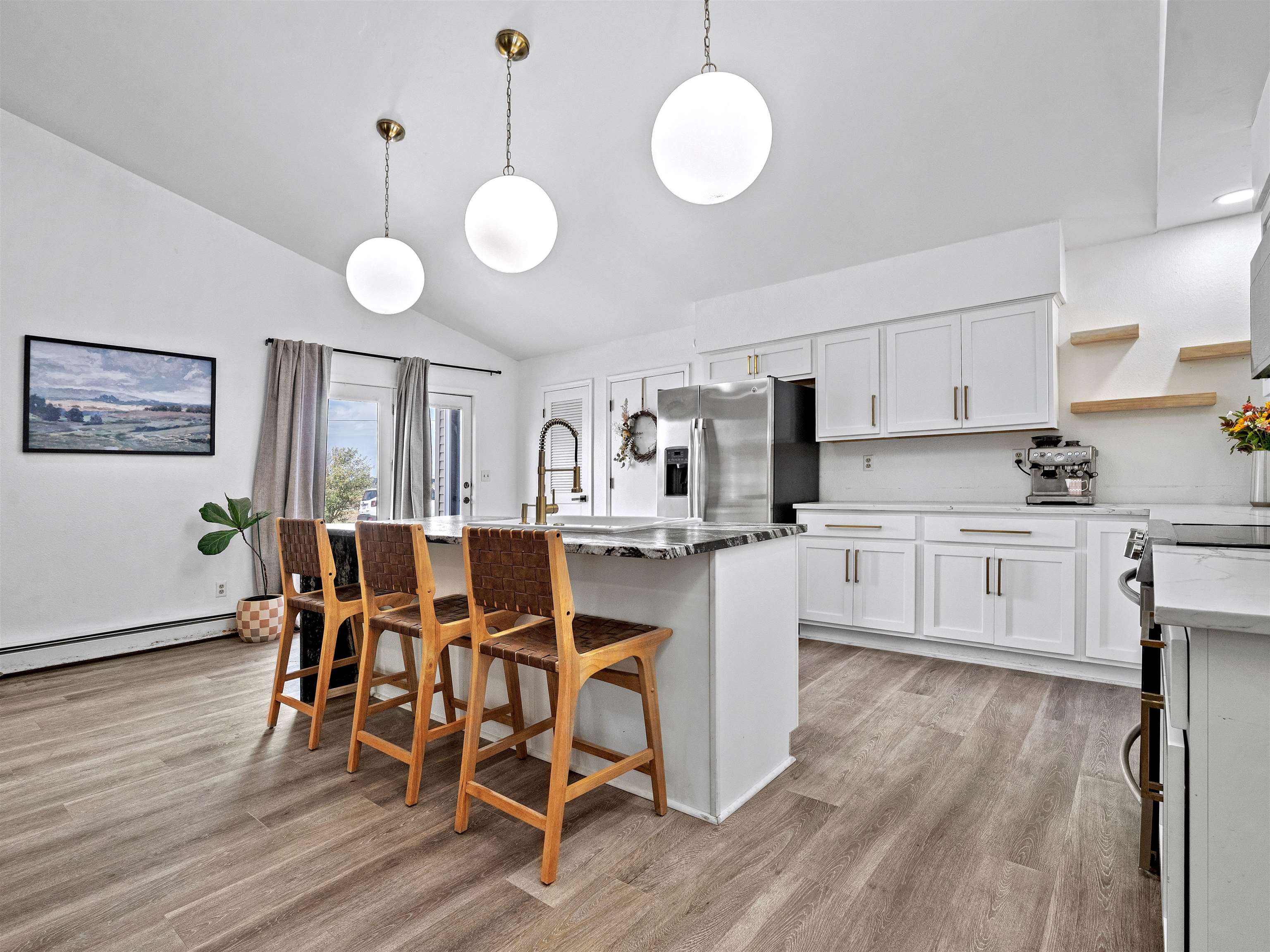 948 20 Road Fruita, CO 81521 - Photo 17 of 38 a view of kitchen with cabinets and wooden floor