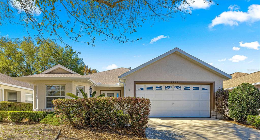 9648 Southwest 92nd Place Road Ocala, FL 34481 - Photo 1 of 1 a front view of a house with a garden