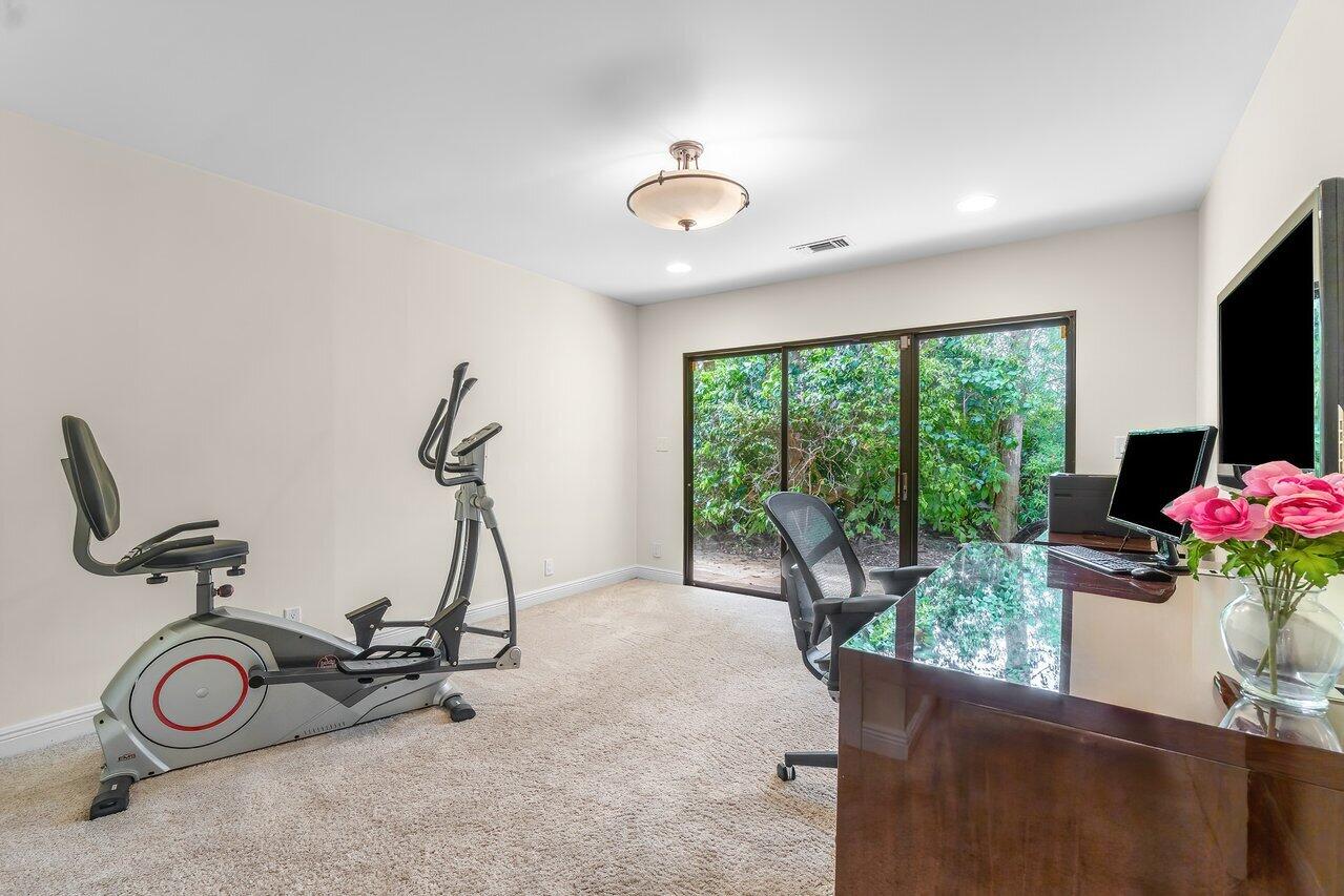 7517 Cedarwood Circle Boca Raton, FL 33434 - Photo 23 of 63 a view of a room with gym equipment