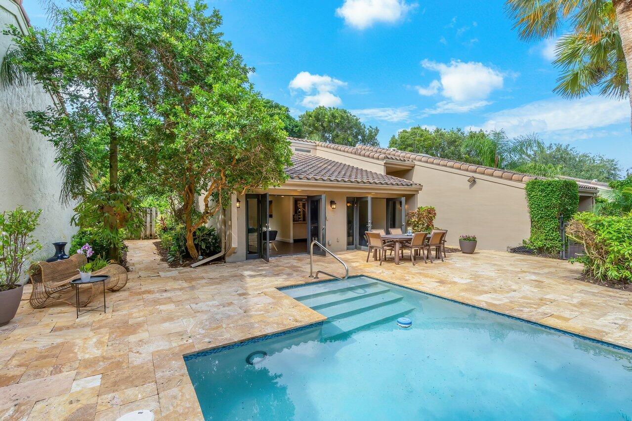 7517 Cedarwood Circle Boca Raton, FL 33434 - Photo 31 of 63 a view of a backyard with sitting area and furniture