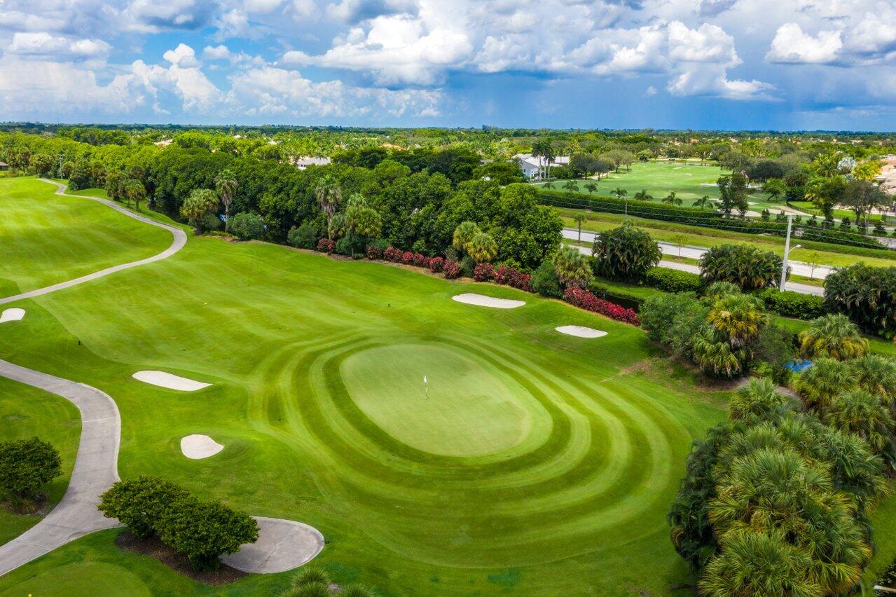 7517 Cedarwood Circle Boca Raton, FL 33434 - Photo 50 of 63 a view of a golf course with a swimming pool