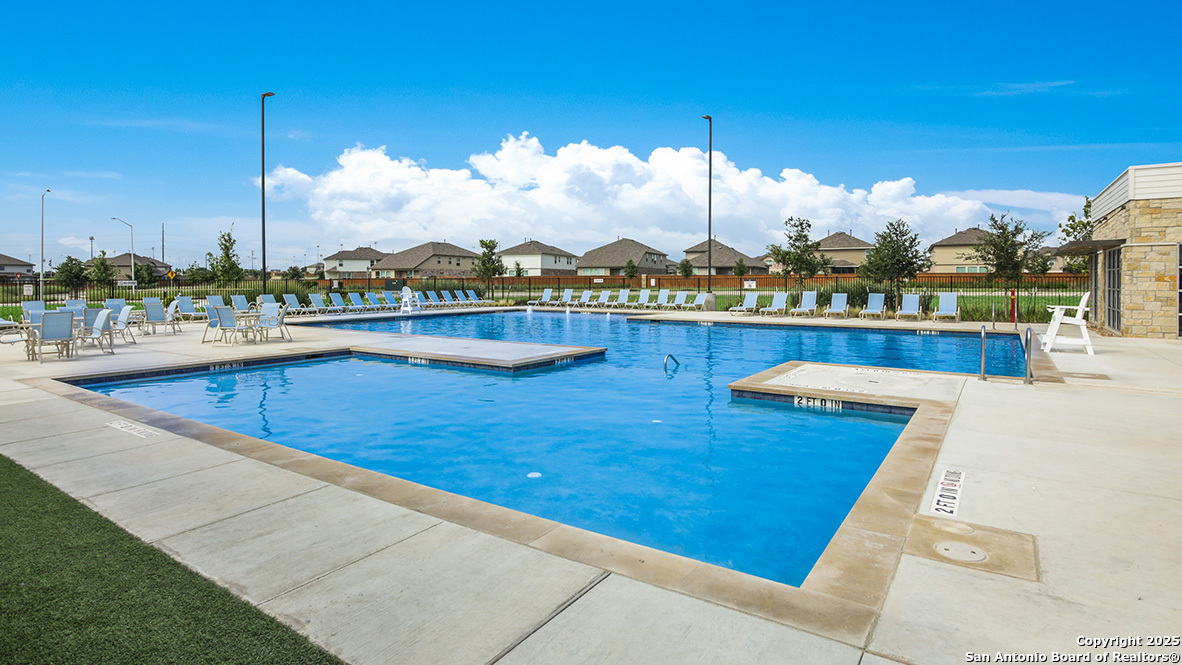 639 Fluted Shoals Cibolo, TX 78108 - Photo 33 of 43 a view of a swimming pool with a lounge chair