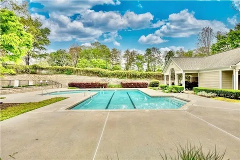 a view of a yard with sitting area