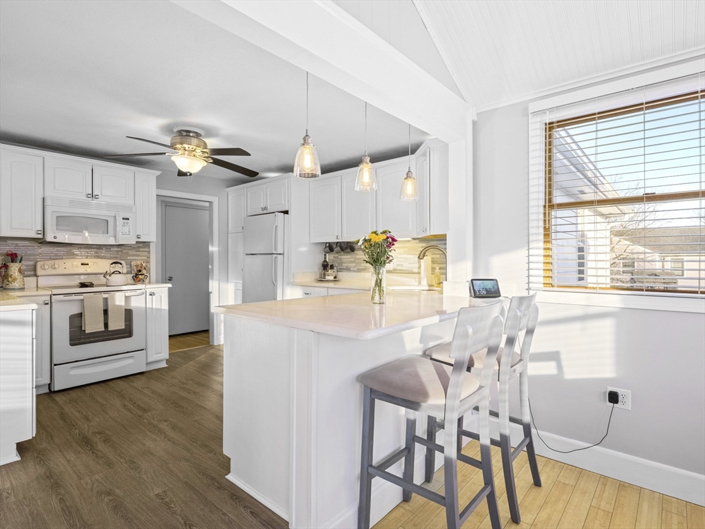 1 Mansfield Drive Wakefield, MA 01880 - Photo 12 of 41 a view of kitchen with cabinets and wooden floor