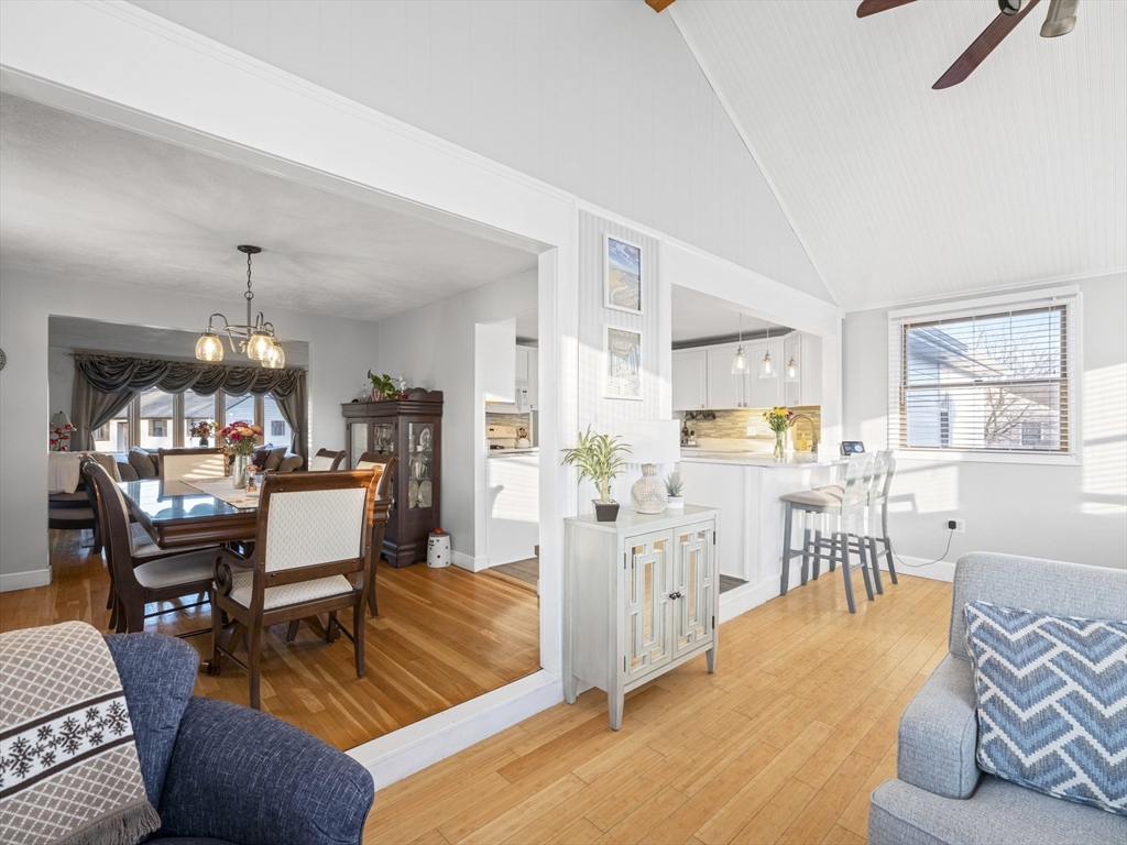 1 Mansfield Drive Wakefield, MA 01880 - Photo 15 of 41 a living room with furniture dining table a lamp and a window