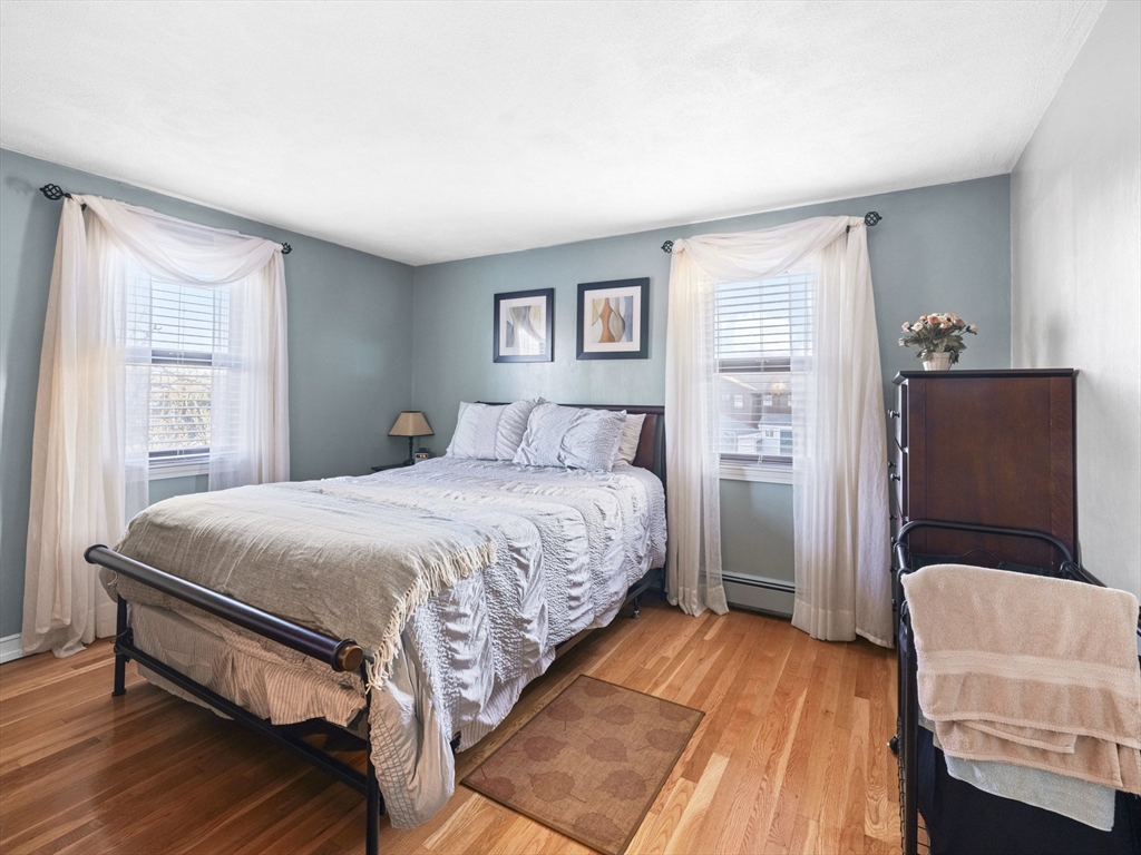 1 Mansfield Drive Wakefield, MA 01880 - Photo 18 of 41 a bedroom with a bed and a couch