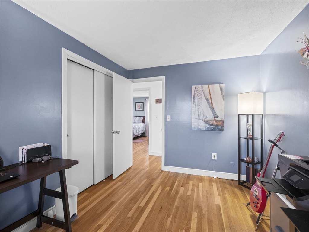 1 Mansfield Drive Wakefield, MA 01880 - Photo 23 of 41 a bedroom with a bed and a desk