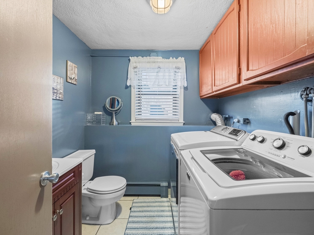 1 Mansfield Drive Wakefield, MA 01880 - Photo 24 of 41 a bathroom with a sink toilet and window