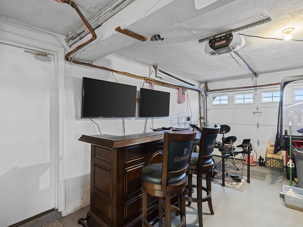 1 Mansfield Drive Wakefield, MA 01880 - Photo 29 of 41 a view of a livingroom with furniture and a flat screen tv