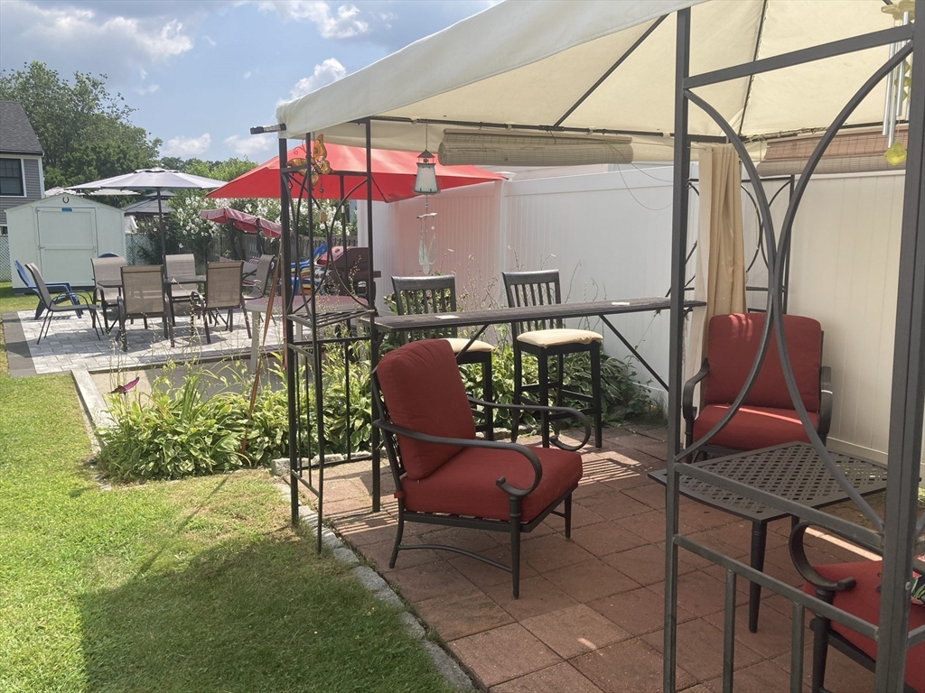 1 Mansfield Drive Wakefield, MA 01880 - Photo 33 of 41 a chair and tables in the patio