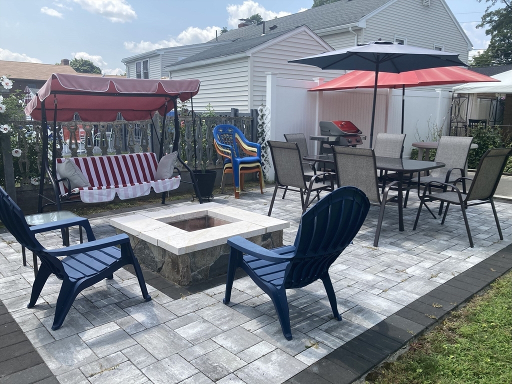 1 Mansfield Drive Wakefield, MA 01880 - Photo 34 of 41 a view of a chairs and table in the patio