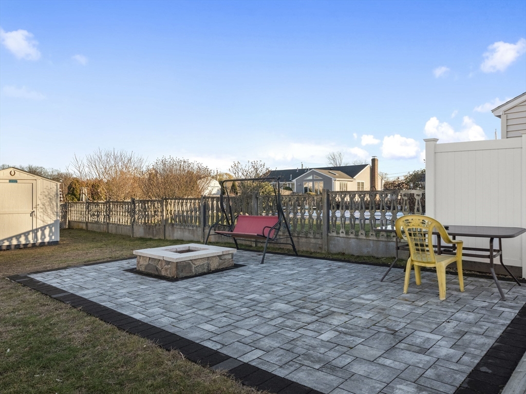 1 Mansfield Drive Wakefield, MA 01880 - Photo 36 of 41 a roof deck with table and chairs
