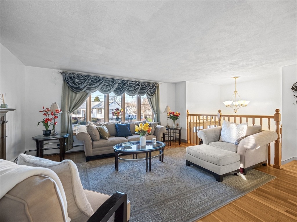 1 Mansfield Drive Wakefield, MA 01880 - Photo 4 of 41 a living room with furniture and a potted plant