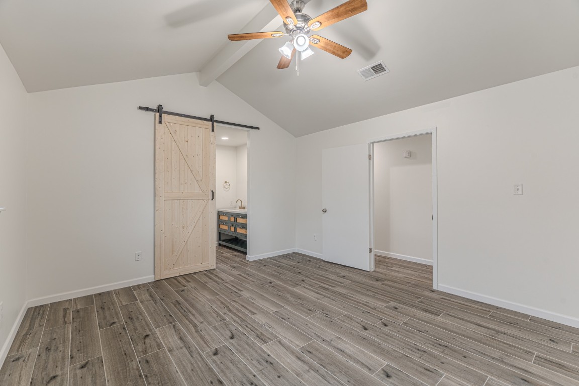 5819 Sunnygate Drive Spring, TX 77373 - Photo 14 of 26 wooden floor in an empty room with a fan