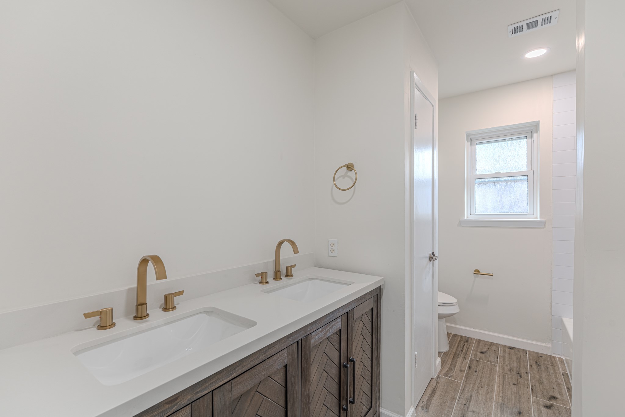 5819 Sunnygate Drive Spring, TX 77373 - Photo 19 of 26 a bathroom with a sink and a toilet