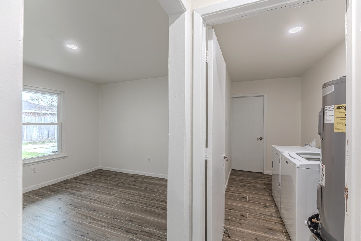 5819 Sunnygate Drive Spring, TX 77373 - Photo 22 of 26 a view of a room with a sink and wooden floor
