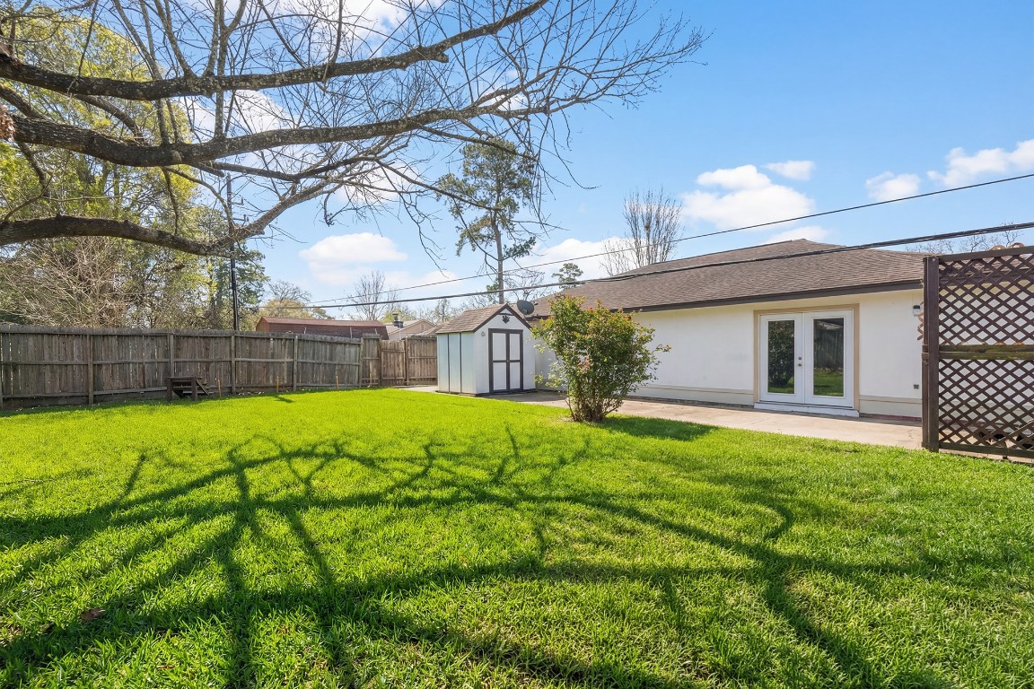 5819 Sunnygate Drive Spring, TX 77373 - Photo 24 of 26 a view of a backyard with a garden