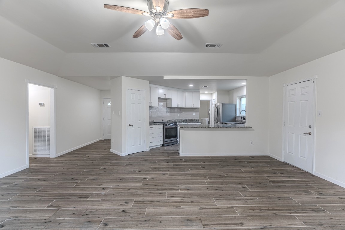 5819 Sunnygate Drive Spring, TX 77373 - Photo 10 of 26 a view of kitchen and kitchen with sink wooden floor and window