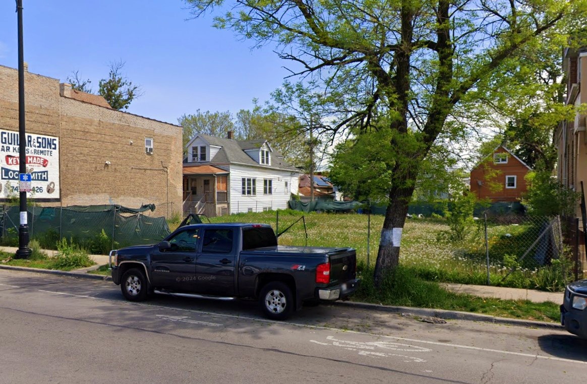 2419 North Central Avenue Chicago, IL 60639 - Photo 3 of 5 a car parked in front of a house