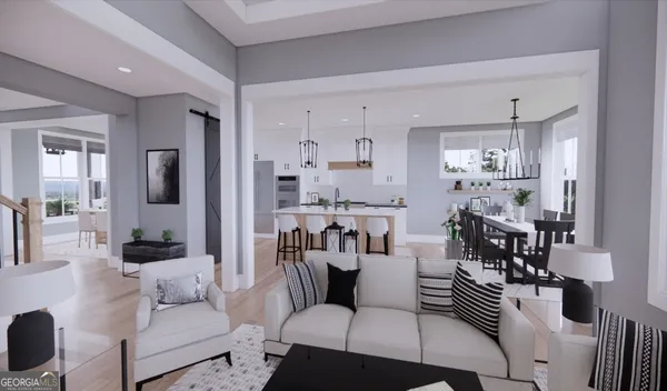 a living room with furniture and a chandelier