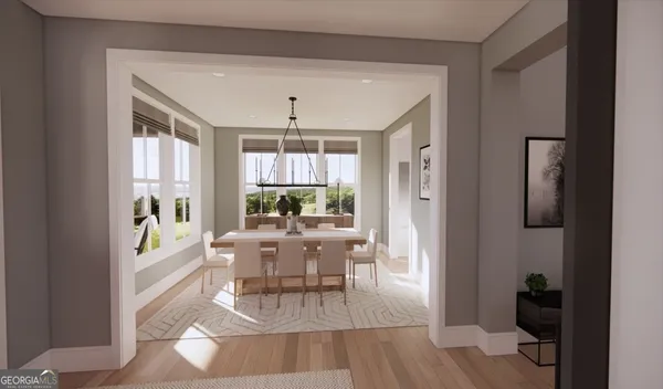 a living room with furniture and a dining table with kitchen view