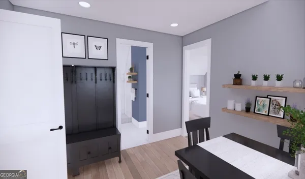 a living room with furniture and wooden floor