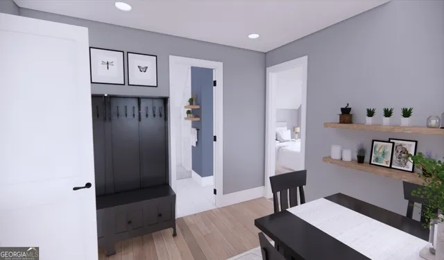 a living room with furniture and wooden floor