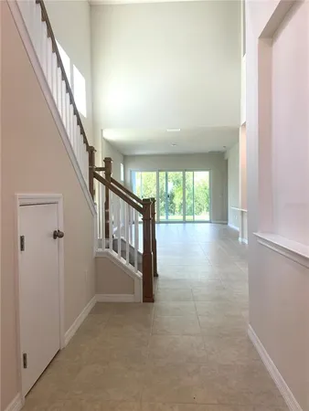 a view of an entryway with wooden floor