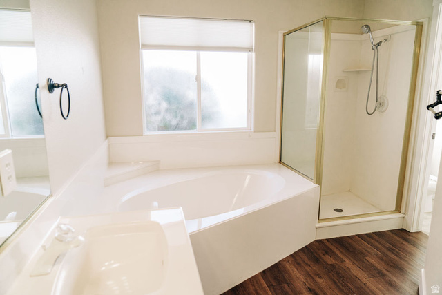 1825 West Mathis Park Place, Unit 40 St. George, UT 84770 - Photo 19 of 28 Bathroom featuring a stall shower, a bath, dark wood finished floors, and vanity