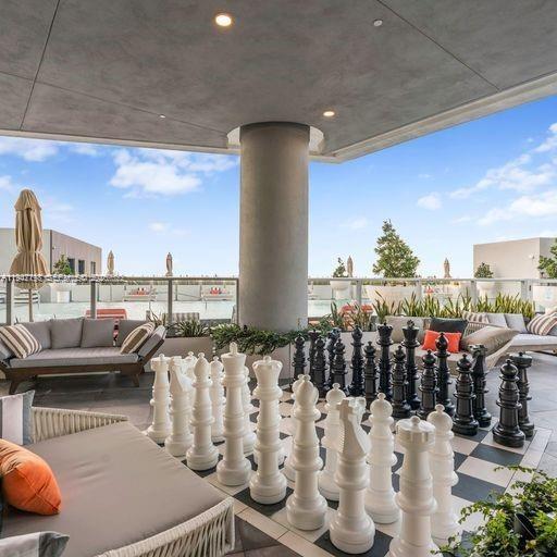 2000 Metropica Way, Unit 1602 Sunrise, FL 33323 - Photo 25 of 50 a outdoor living space with furniture and a potted plant