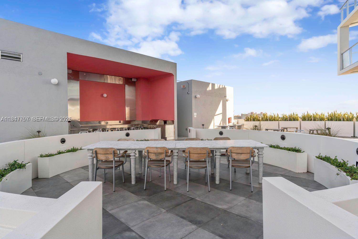 2000 Metropica Way, Unit 1602 Sunrise, FL 33323 - Photo 28 of 50 a view of a chairs and tables in the terrace