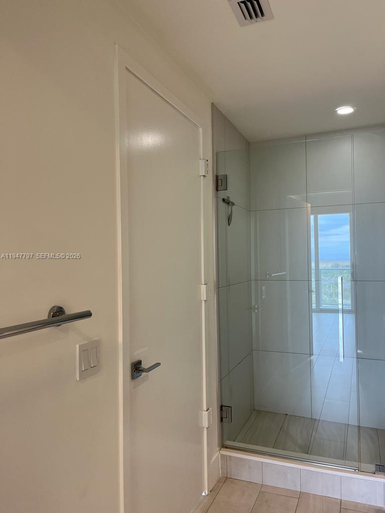 2000 Metropica Way, Unit 1602 Sunrise, FL 33323 - Photo 41 of 50 a bathroom with a shower