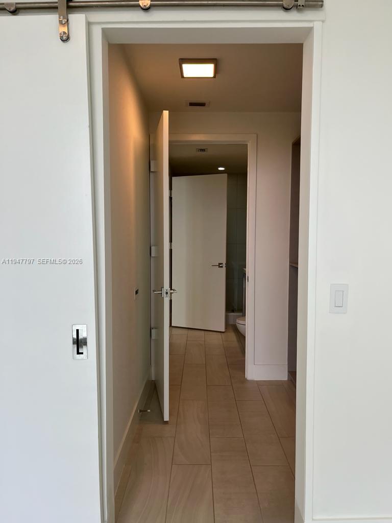 2000 Metropica Way, Unit 1602 Sunrise, FL 33323 - Photo 42 of 50 a view of a hallway