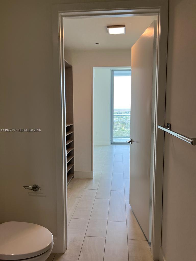 2000 Metropica Way, Unit 1602 Sunrise, FL 33323 - Photo 47 of 50 a bathroom with a toilet and a shower