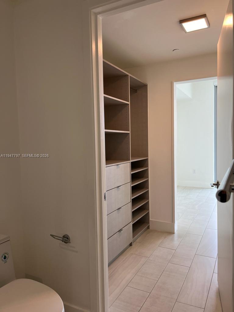 2000 Metropica Way, Unit 1602 Sunrise, FL 33323 - Photo 48 of 50 a bathroom with a toilet