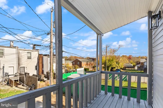 a view of a balcony with wooden floor