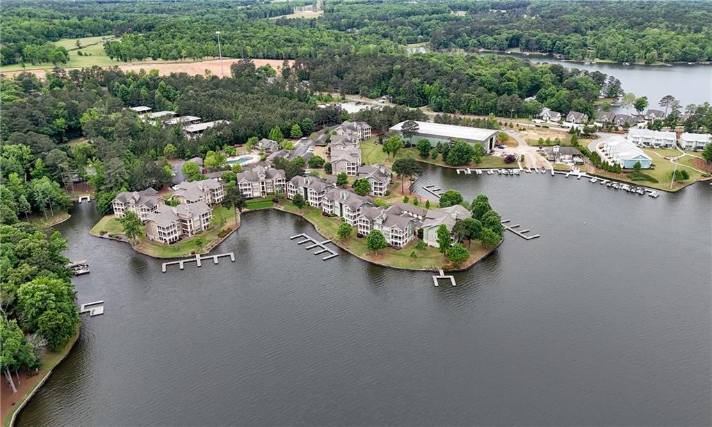 117 South Bay Road, Unit 402 Eatonton, GA 31024 - Photo 4 of 48 an aerial view of a house with a garden and lake view
