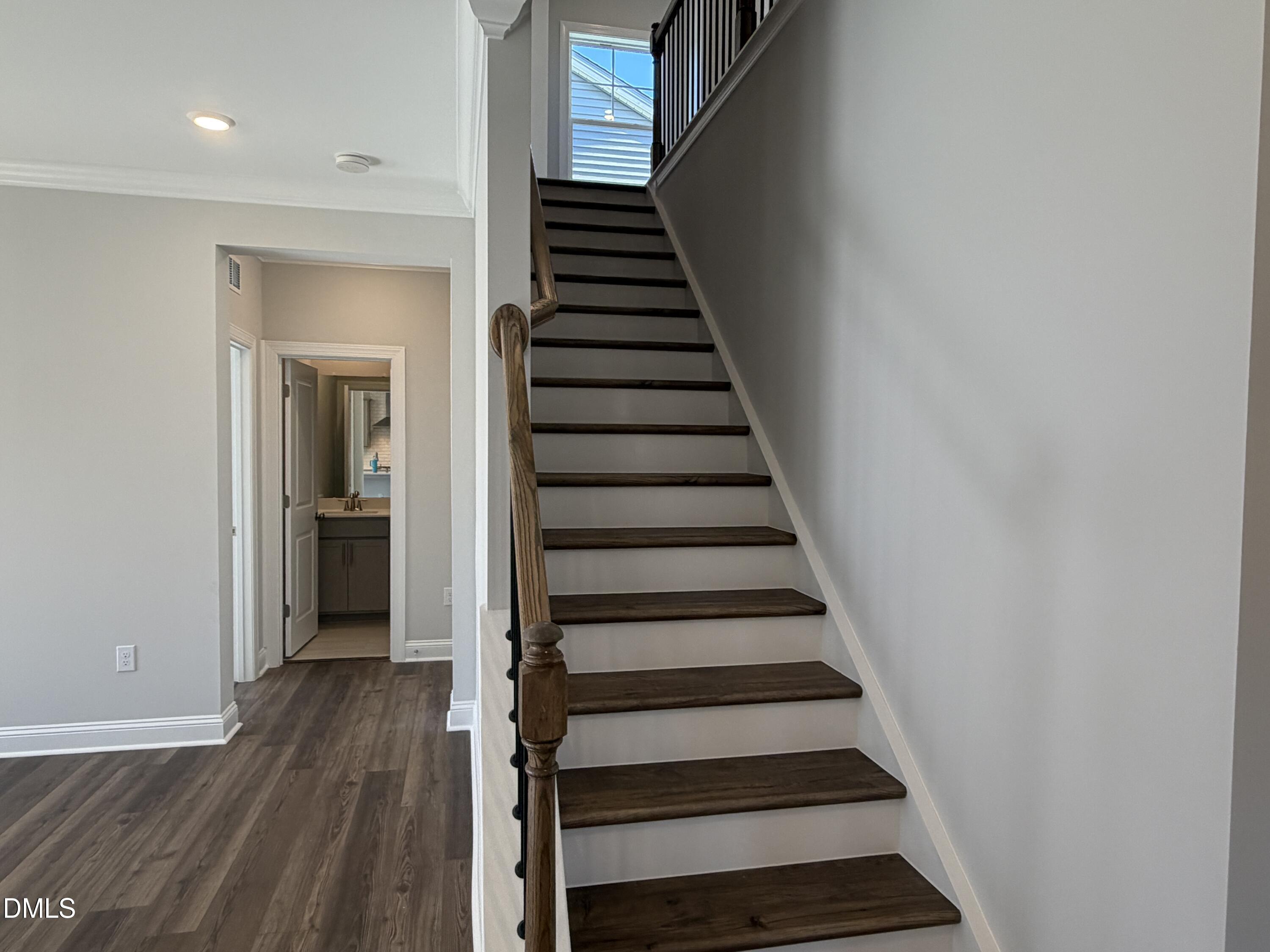 3016 Sandy Bluff Road Raleigh, NC 27616 - Photo 17 of 34 a view of a hallway with wooden floor and entryway