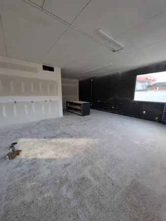 a view of a projector room with projector and screen