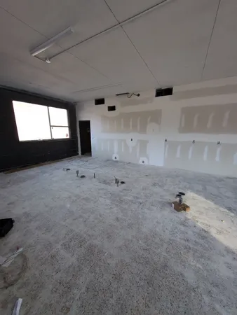 a view of an empty room and window