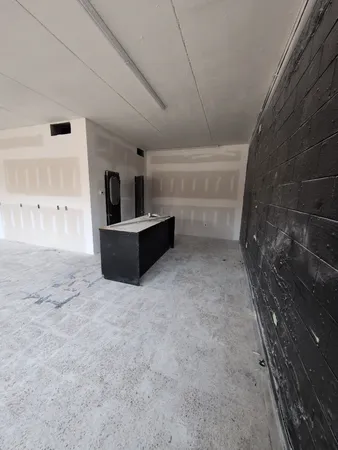 a view of a livingroom with furniture and window