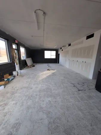 a view of room with window and projector