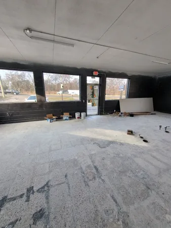 a view of room with wooden floor