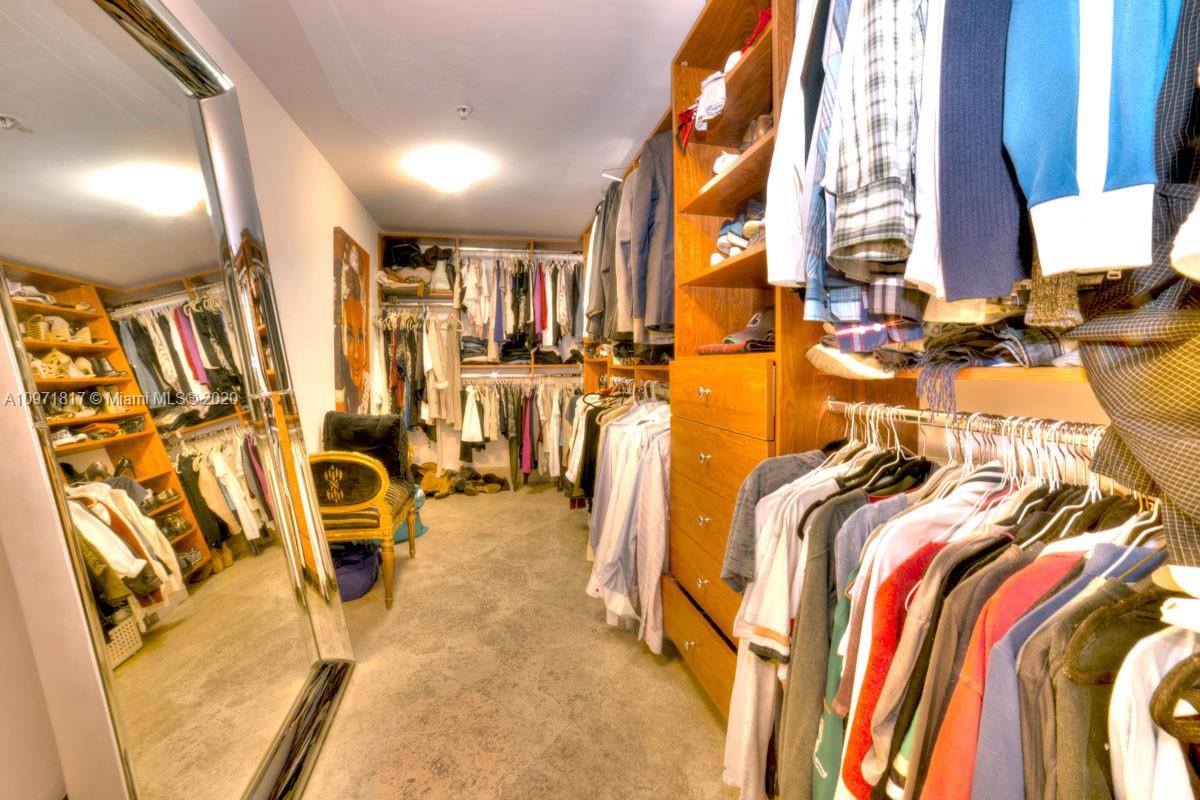 3540 Main Highway, Unit 301 Miami, FL 33133 - Photo 13 of 29 a view of walk in closet with clothes