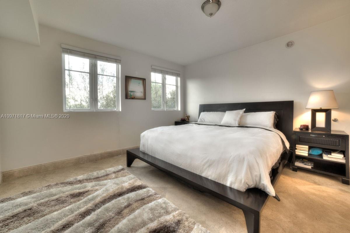 3540 Main Highway, Unit 301 Miami, FL 33133 - Photo 16 of 29 a bedroom with a bed and window
