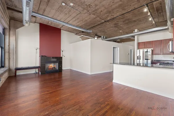 a view of a livingroom with wooden floor